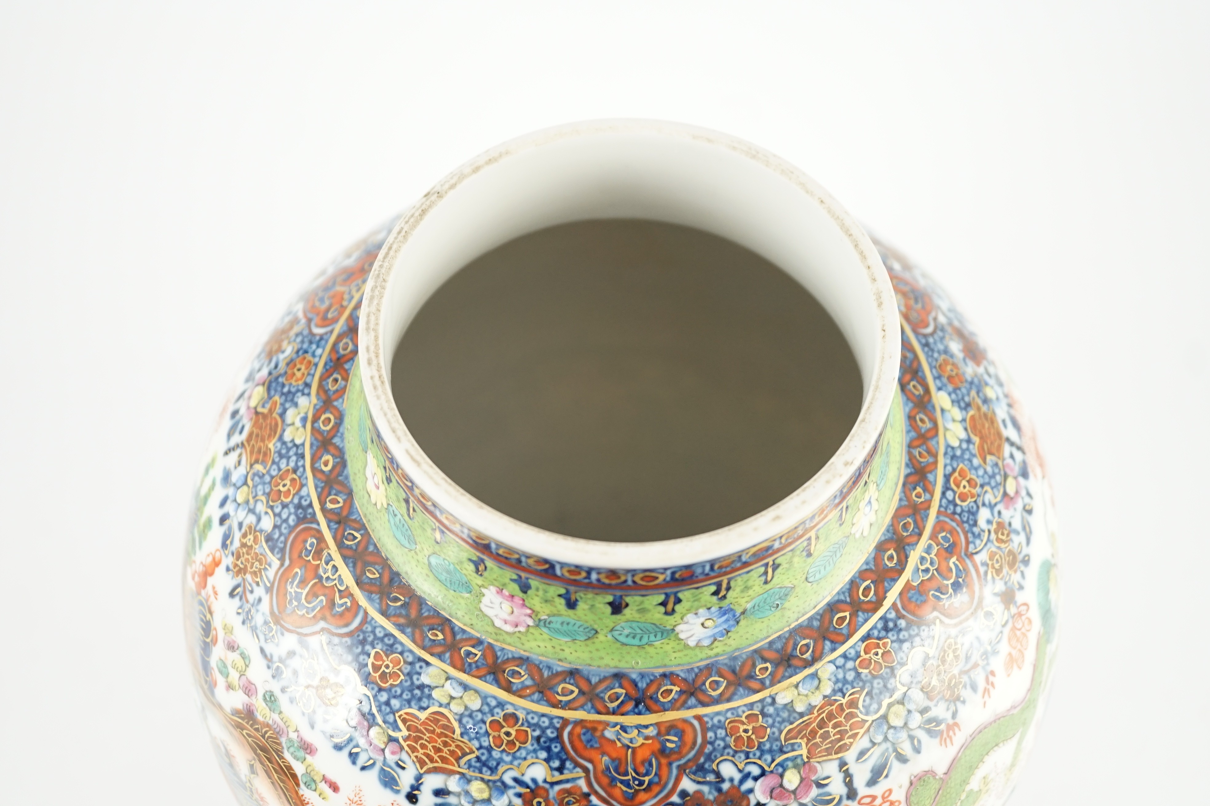 A Chinese clobbered blue and white vase and cover, 18th/19th century, 47cm high
